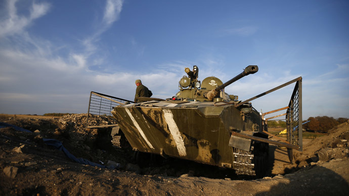 A Ukrainian serviceman is pictured next to an armored vehicle near the village of Debaltsevo in eastern Ukraine. (Reuters/David Mdzinarishvili)