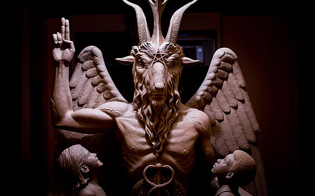 A bronze Baphomet, which depicts Satan as a goat-headed figure surrounded by two children