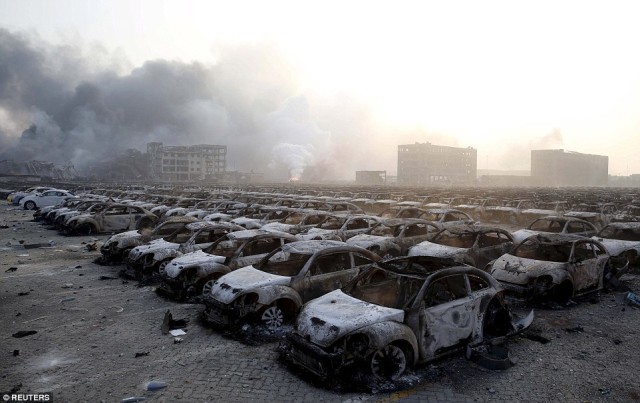 Thousands of burnt out Volkswagen Beetles close to ground zero in Tianjin.