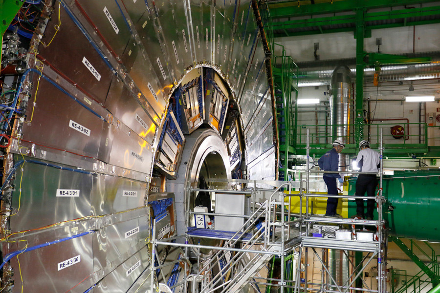 Technicians are seen working in the Compact Muon Solenoid (CMS) experiment, part of the Large Hadron Collider (LHC), during a media visit to the Organization for Nuclear Research (CERN) in the French village of Cessy, near Geneva in Switzerland © Pierre Albouy 