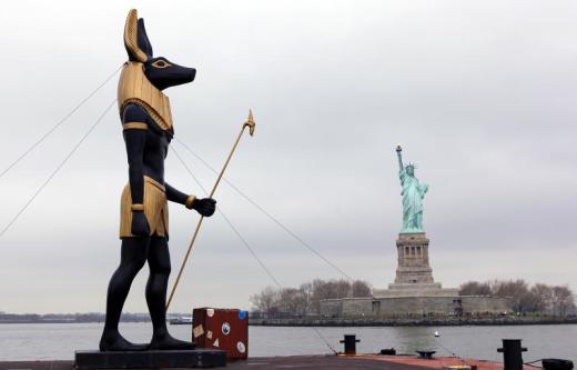 7-ton-replica-statue-of-the-egyptian-god-anubis-passes-by-the-statue-of-liberty-in-new-york.jpg