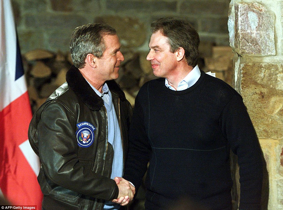 Close: Bush and Blair are pictured above shaking hands at a meeting near Camp Davis in February 2001