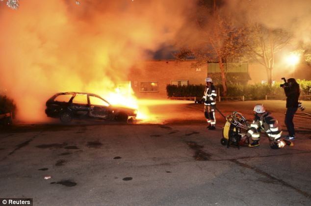 As well as setting cars ablaze, rioters also attacked a police station and a school and nursery