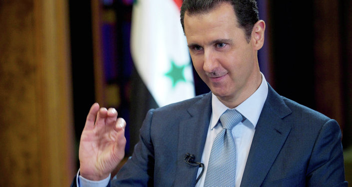 In this Tuesday, Feb. 10, 2015 file photo released by the Syrian official news agency SANA, Syrian President Bashar Assad gestures during an interview with the BBC, in Damascus, Syria