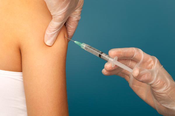 Close up of a vaccination protection Influenza on a blue background. [url=file_search.php?action=file&lightboxID=4800358][img]http://02b5b0c.netsolhost.com/stock/banniere1.jpg[/img][/url]
