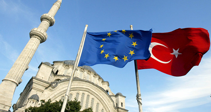 Flags of Turkey, right, and the European Union are seen in front of a mosque in Istanbul, Turkey