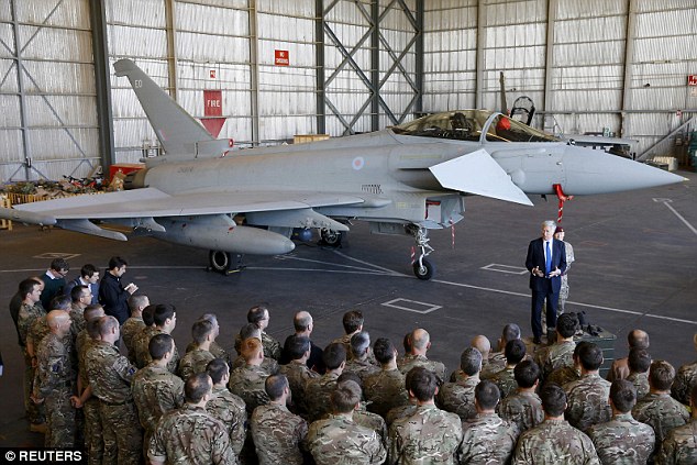 'War is a messy business': Defence Secretary Michael Fallon (pictured speaking to RAF personnel in front of a Typhoon at RAF Akrotiri in Cyprus) urged the public to be prepared for 'setbacks' in the campaign against ISIS