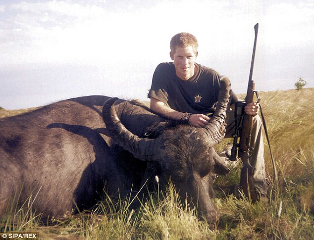 Crouching over the body of a water buffalo: The picture was taken in November 2004, when the then 20-year-old was on a gap year trip to South America shortly before he enrolled at Sandhurst military academy