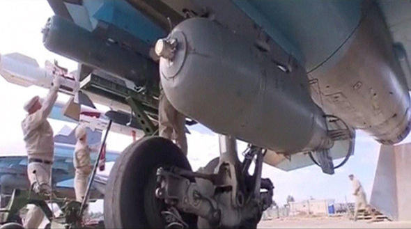 Russian bombs being fitted to Su-24 warplanes