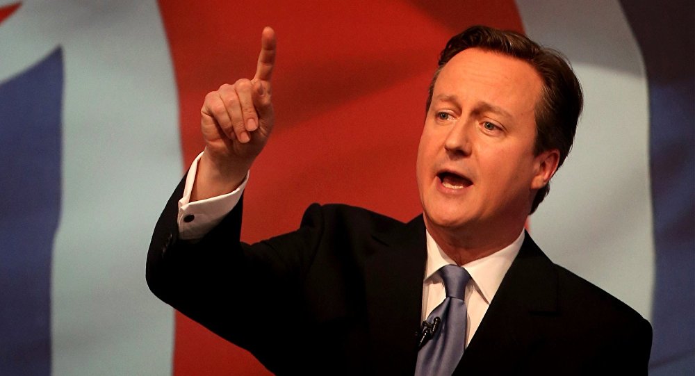 Britain's Prime Minister David Cameron gestures as he unveils the Conservative party manifesto, in Swindon, England, Tuesday April 14, 2015.
