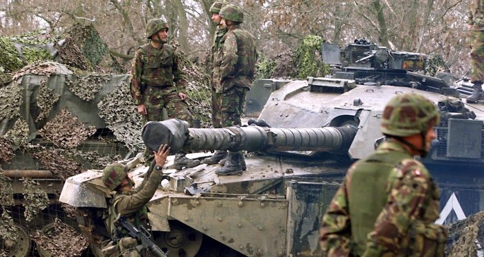 British 'tankers' from the fourth royal armoured brigade with Challenger tanks hold their position near Skopje airport 27 March 1999.