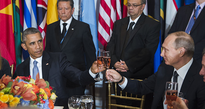 In this Monday, Sept. 28, 2015, photo, provided by the United Nations, US President Barack Obama, left, and Russia's President Vladimir Putin toast during a luncheon hosted during the 70th annual United Nations General Assembly at U.N. headquarters