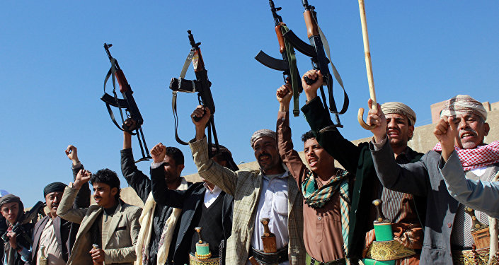 Supporters of Shiite Huthi rebels and militiamen shout slogans raising their weapons during a rally against the Saudi-led coalition, which has been leading the war against the Iran-backed rebels, on December 17, 2015 in Sanaa
