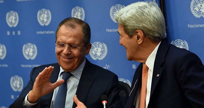 Foreign Minister of Russia Sergey Lavrov (L) and US Secretary of State John Kerry shake hands