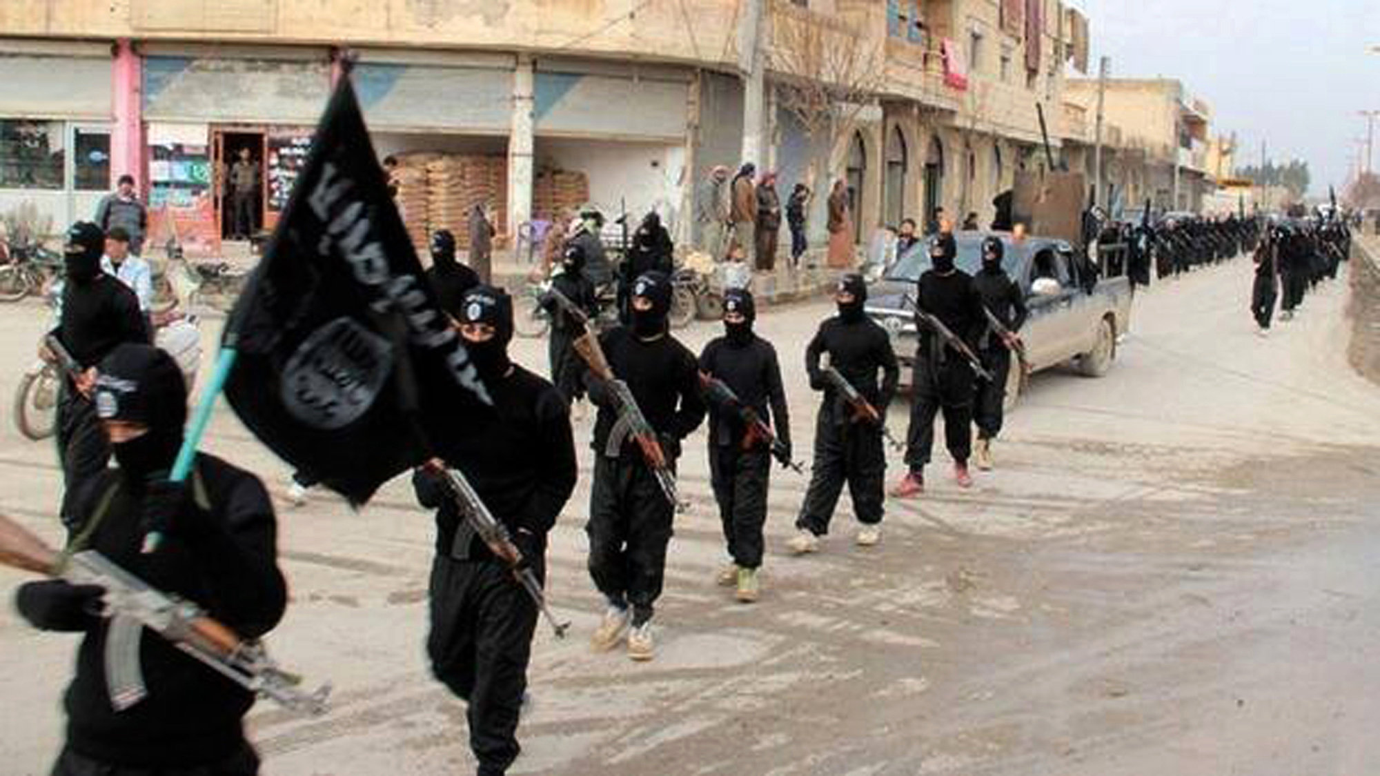 Fighters from the al-Qaida linked Islamic State of Iraq and the Levant (ISIL) marching in Raqqa, Syria