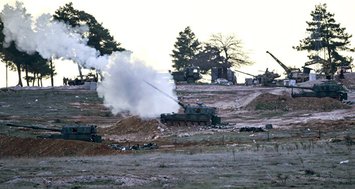 Tanks stationed at a Turkish army position near the Oncupinar crossing gate close to the town of Kilis, south central Turkey, fire towards the Syria border, on February 16, 2016.