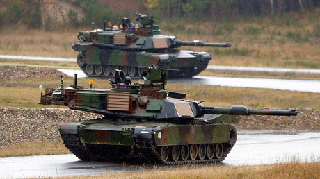 U.S. Soldiers take part in an exercise in M1A2 Abrams tanks, alongside NATO allies at the Joint Multinational Training Command in Grafenwoehr November 18, 2014. © Michael Dalder