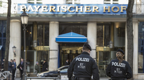 Policemen walk in front of the Bayerischer Hof hotel, the location for the 52nd Munich Security Conference (MSC), in Munich, southern Germany, on February 11, 2016. © Thomas Kienzle