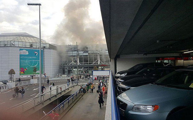 A plume of smoke rises over Brussels airport after an explosion