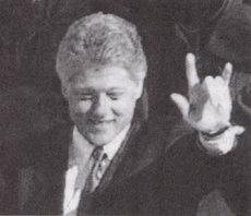 Bill Clinton flaunts a satanic salute for those in the know.