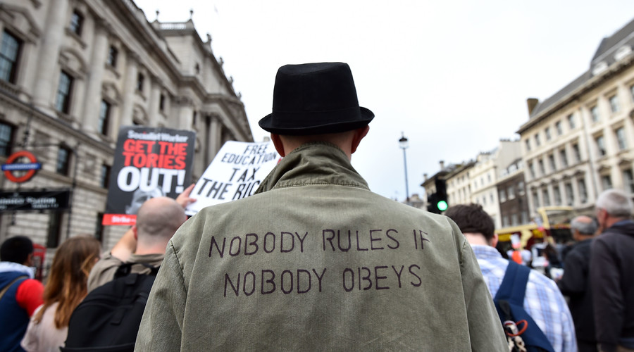 Protestors march during an anti-austerity demonstration in London. © Ben Stansall