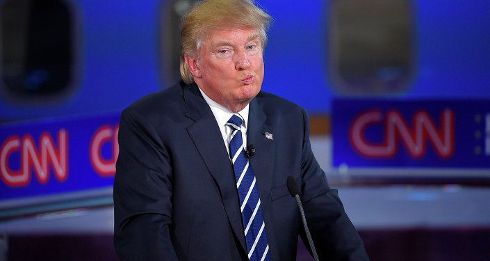 Republican presidential candidate, businessman Donald Trump reacts during the CNN Republican presidential debate.