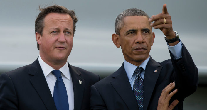 US President Barack Obama, right, stands alongside British Prime Minister David Cameron