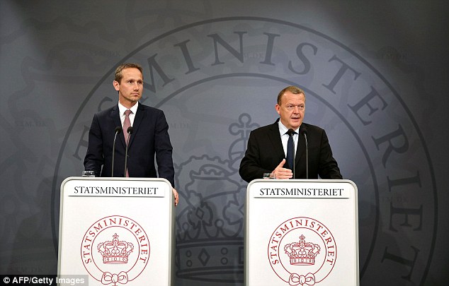 Danish prime minister Lars Loekke Rasmussen (R) and Danish foreign minister Kristian Jensen speak to media after Britain's voted to leave the European Union