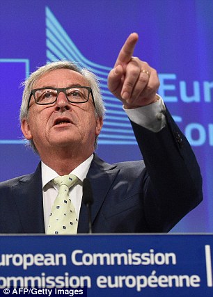 European Commission President Jean-Claude Juncker, right, is feeling the heat