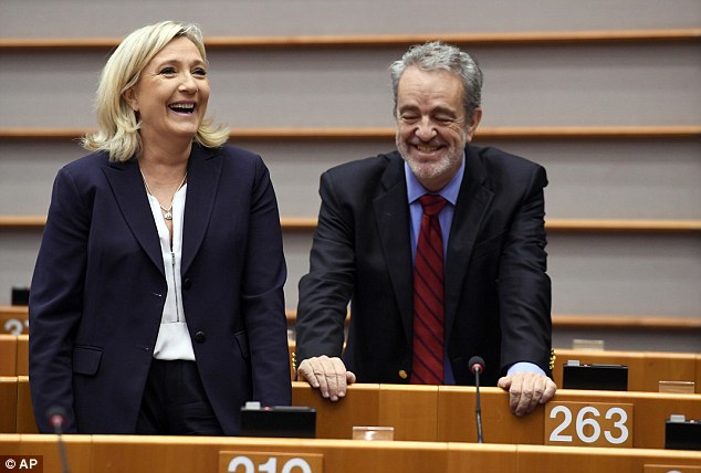 France's Front National leader Marine Le Pen, left, shares a joke today with Gerolf Annemans, who leads the Flemish far-right Vlaams Belang party in Belgium