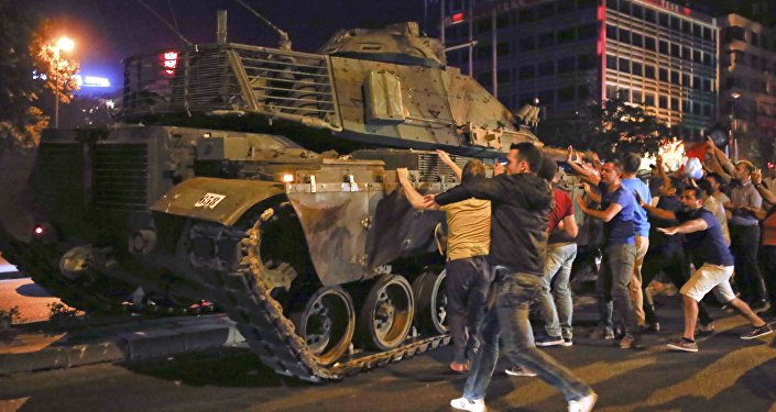 People React Near A Military Vehicle During An Attempted Coup In Ankara