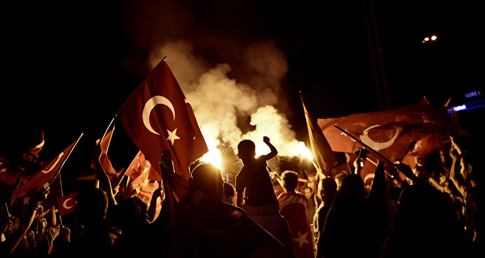 Pro-Erdogan supporters wave Turkish national flags during a rally at Taksim square in Istanbul on July 18, 2016 following the military failed coup attempt of July 15