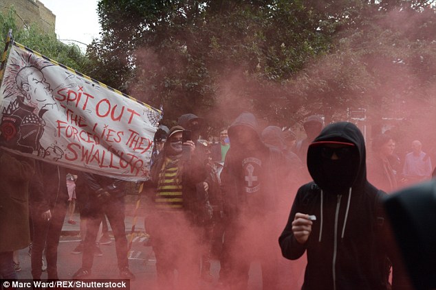 Mob: Anarchists let off smoke bombs outside Boris Johnson's home and chanted slogans outside the property