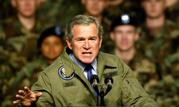 President George W Bush speaks to American soldiers 2003, a few week before invading Iraq. Photograph: Jeff Mitchell/Reuters 