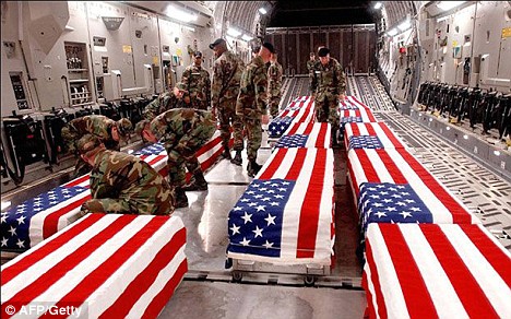 PHOTO: Offloading coffins of US soldiers killed in Iraq at Dover Air Base in Delaware. 4,486 U.S. soldiers died in Iraq and 2,345 U.S. soldiers died in Afghanistan, 1 million U.S. soldiers wounded in both wars, and a potential cost of up to $6 trillion.