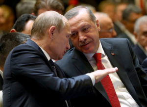 epa04510989 A handout picture provided by Turkish Presidential Press Office shows Russian President Vladimir Putin (L) and his Turkish counterpart Recep Tayyip Erdogan (R) chatting before a press conference in the new presidential palace in Ankara, Turkey, 01 December 2014. Putin and Erdogan began a meeting in Ankara to discuss their often opposing views on the crisis in Syria, the Islamic State threat and gas supplies to Turkey. Russia agreed to send more gas to Turkey and charge 6 per cent less for the energy, starting in January. Putin is on a one-day official visit to Turkey. EDITORIAL USE ONLY, NO SALES EPA/TURKISH PRESIDENTIAL PRESS OFFICE / HANDOUT
