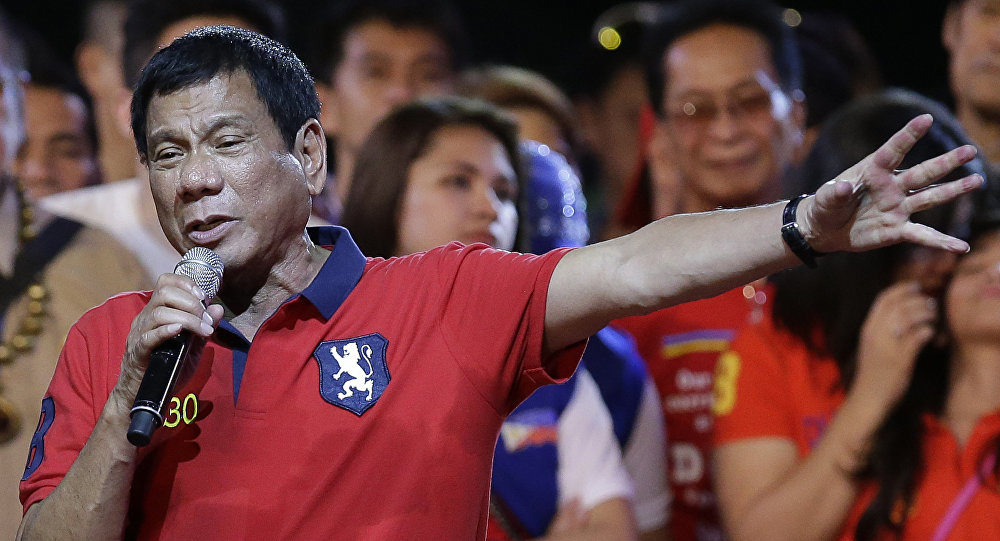 Philippine presidential race front-runner Davao city mayor Rodrigo Duterte gestures during his final campaign rally in Manila, Philippines on Saturday, May 7, 2016.