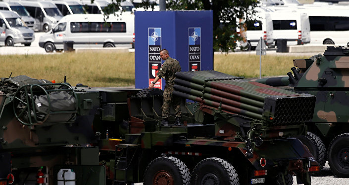Polish soldier prepares a military exhibition in front of the venue of the NATO Summit, which will start in two days, in Warsaw, Poland, July 6, 2016.