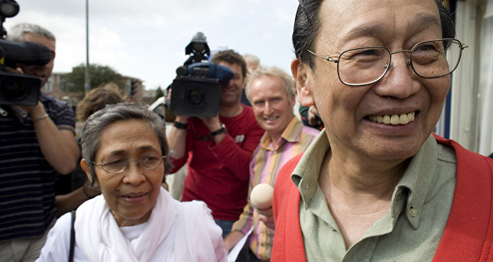 Philippine communist leader Jose Maria Sison, right, smiles after being released from Scheveningen prison outside The Hague, the Netherlands, Thursday, Sept. 13, 2007.