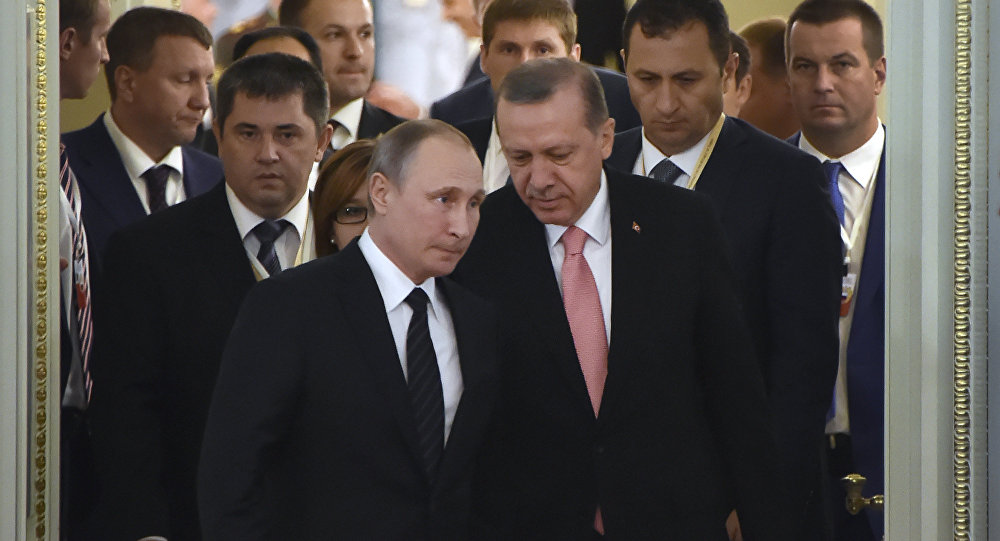 Russian President Vladimir Putin (C-L) and his Turkish counterpart Recep Tayyip Erdogan (C-R) enter a hall to start their meeting with Russian and Turkish entrepreneurs in Konstantinovsky Palace outside Saint Petersburg on August 9, 2016