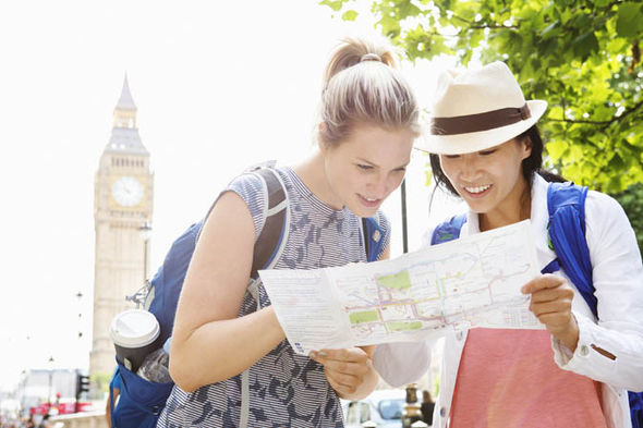 tourists looking at map in London