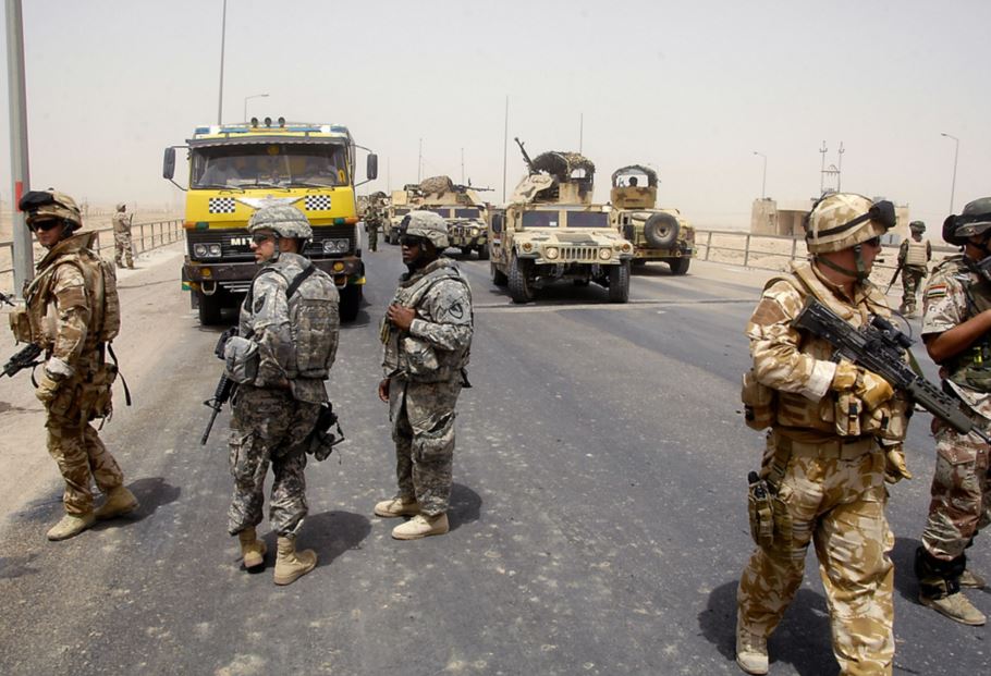 UK, US, and Iraqi soldiers at a checkpoint in Basra, Iraq in 2008. U.S. Army / Flickr