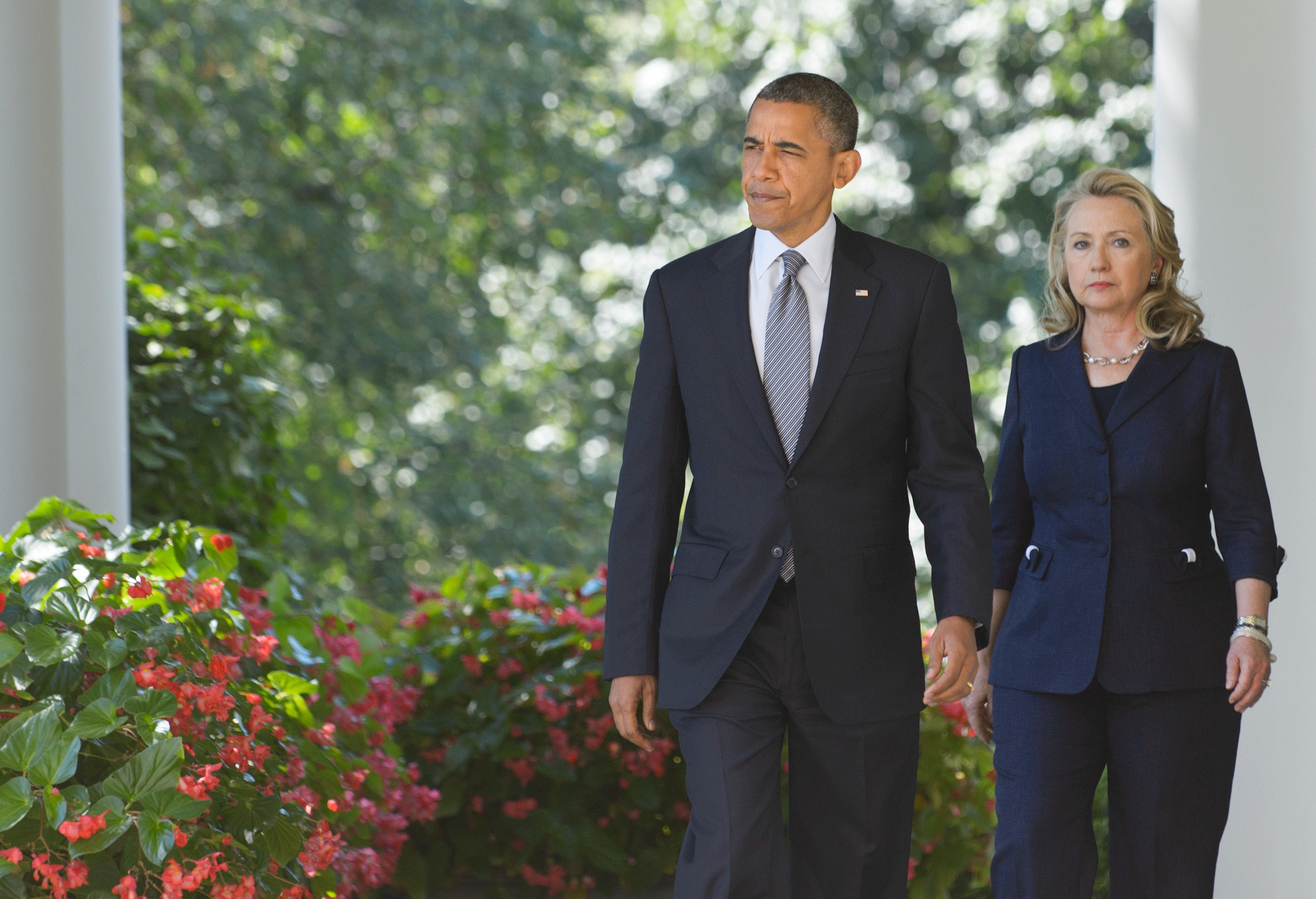 Image result for Secretary of State Hillary Clinton walks with President Barack Obama on Sept. 12, 2012