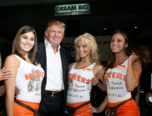 ATLANTIC CITY, NJ - SEPTEMBER 01:  Donald J.Trump poses with Hooters Girls at the Donald Trump's Ultimate Deal Cash Giveaway at the Trump Marina Hotel and Casino on September 1, 2007 in Atlantic Ciyt, New Jersy.  (Photo by Nick Valinote/FilmMagic)