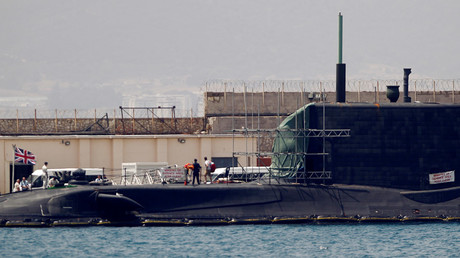 A man leaves the British nuclear Astute-class submarine HMS Ambush © Jon Nazca