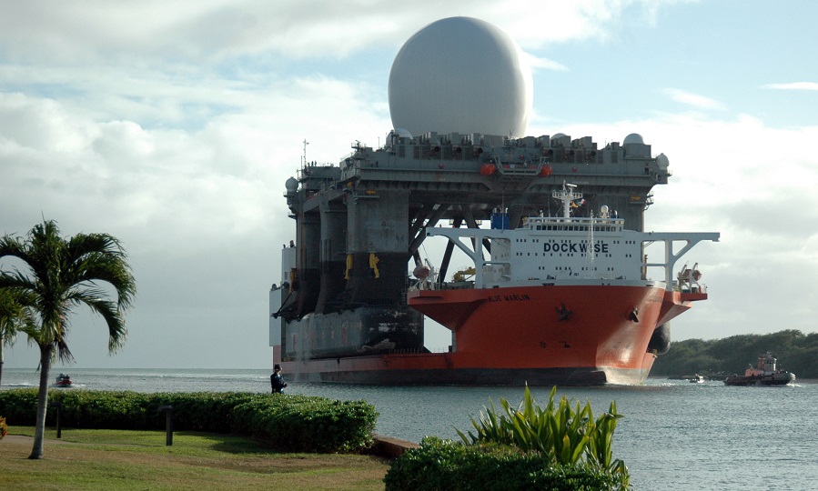 060109-N-3019M-011 PEARL HARBOR, Hawaii (January 9, 2006) The Sea Based X-Band Radar (SBX) navigates the channel as it enters Pearl Harbor, Hawaii aboard the heavy lift vessel MV Blue Marlin after completing a 15,000-mile journey from Corpus Christi, Texas.  SBX is a combination of the worldÕs largest phased-array X-band radar carried aboard a mobile, ocean-going semi-submersible oil platform.  It will provide the nation with highly advanced ballistic missile detection and will be able to discriminate a hostile warhead from decoys and countermeasures.  SBX will undergo minor modifications, post-transit maintenance and routine inspections in Pearl Harbor before completing its voyage to its homeport of Adak, Alaska in the Aleutian Islands.    U.S. Navy photo by Journalist 2nd Class Ryan C. McGinley. (RELEASED)