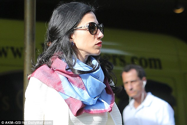 Unhappy together: Huma Abedin and Anthony Weiner were seen on the day DailyMail.com revealed he had sexted a 15-year-old girl, setting off the explosive chain of events leading to the renewed FBI probe