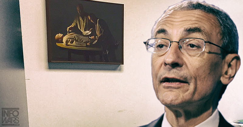 John Podesta sitting in his office during an interview. Hanging on the wall is painting that clearly alludes to cannibalism. This is not even the last time you'll see references to cannibalism in this article.