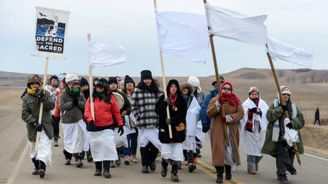 Women march to Backwater Bridge during a protest against plans to pass the Dakota Access pipeline near the Standing Rock Indian Reservation, near Cannon Ball, North Dakota, U.S. November 27, 2016. © Stephanie Keith