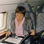 Angela Merkel photographed in 1991 on a plane. 